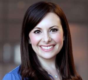 Emily Spector, ESQ., an estate planning, trust, and probate administration expert, exudes professionalism and confidence in a smiling photo.