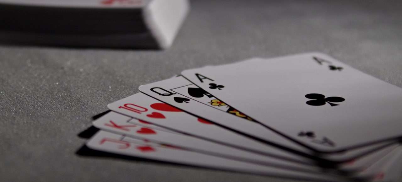 Image of playing cards symbolizing financial transparency in divorce proceedings on the Hera Law Group blog
