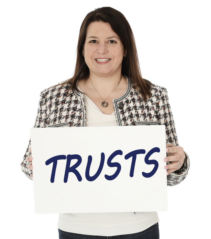 Hera Law Group trusts attorney holding a TRUSTS sign